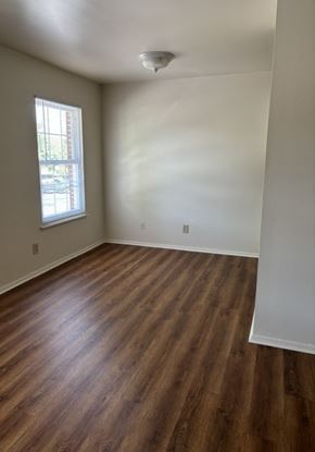 Newport News apartment for rent - A room with wooden flooring and a window.