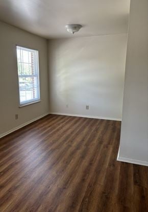 Newport News apartment for rent - A room with wooden flooring and a window.