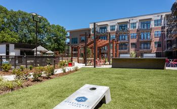 Outdoor grill with intimate seating area at link apartments® linden, chapel hill