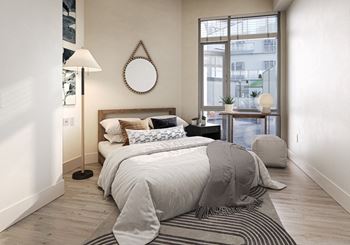 A bedroom with a bed and a window 