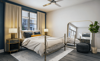 A bedroom with a bed and a mirror