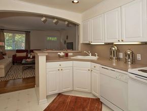 Chapel Hill apartment for rent - A kitchen with white cabinets and a white stove.