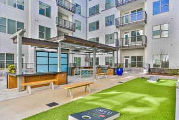Large grill area with corn hole