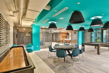 Charlotte apartment for rent - a dining room with tables and chairs and a bowling alley