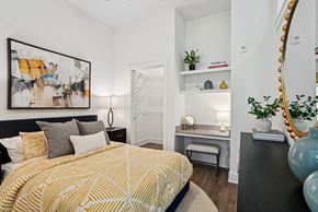 Charlotte apartment for rent - a bedroom with a bed and a mirror on the wall