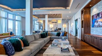 Charlotte apartment for rent - A modern living room with a grey sofa and a coffee table.