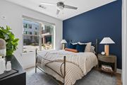 Smyrna apartment for rent - Modern bedroom with navy accent wall at Link ® Lake Park Apartments, Georgia