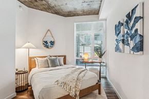 Oakland apartment for rent - a bedroom with a bed and a window at Link Apartments® Four 12, California, 94607