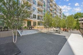 Smyrna apartment for rent - Outdoor courtyard with gravel seating area at Link ® Lake Park Apartments, Smyrna