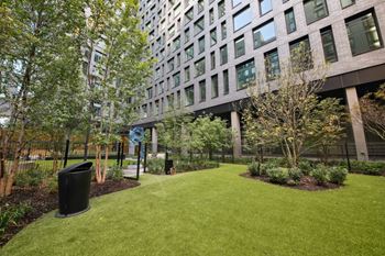 A grassy area in front of a building
