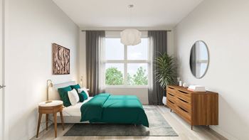 Wood plank flooring in large apartment bedroom 