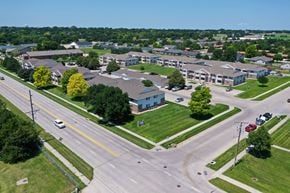 Kearney apartment for rent - A road with cars and a building in the background.