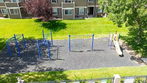 Evans apartment for rent - A playground with a slide, swings, and monkey bars.