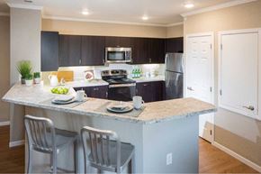 Loveland apartment for rent - a kitchen with a marble counter top