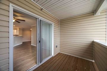 Evans apartment for rent - A room with a sliding glass door leading to a kitchen.