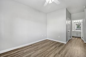 North Las Vegas apartment for rent - A room with a ceiling fan and wooden flooring.