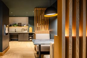 Quincy apartment for rent - A modern kitchen with a dining table and chairs.
