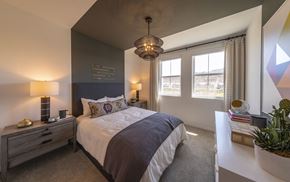 Carlsbad apartment for rent - a bedroom with a large bed and a white table