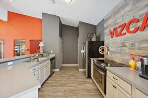 Reno apartment for rent - A kitchen with a refrigerator and a microwave.