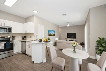 Chandler apartment for rent - A modern kitchen with a dining table and chairs.