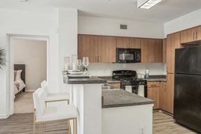 Woodland Hills apartment for rent - a kitchen with an island and a stove and a refrigerator