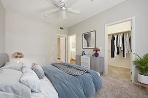 Phoenix apartment for rent - a bedroom with a bed and a ceiling fan