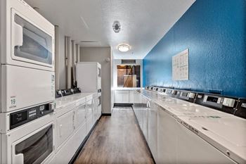 Laundry center with machines next to folding counter