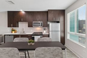 San Diego apartment for rent - A modern kitchen with a table and chairs.