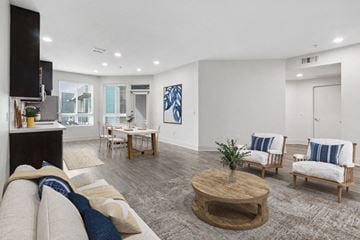San Diego apartment for rent - A living room with a white couch and a coffee table.