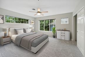 Portland apartment for rent - a bedroom with a bed and a ceiling fan