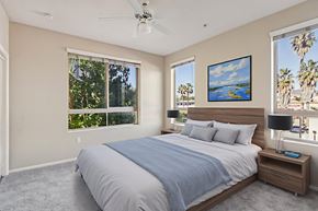 Northridge apartment for rent - A bedroom with a large bed and a ceiling fan.