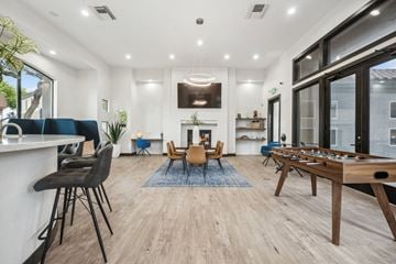 Phoenix apartment for rent - a living room with a table with chairs and a pool table