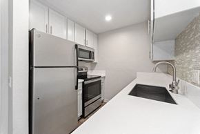 San Diego apartment for rent - modern kitchen with stainless steel appliances at Pointe Luxe Apartment Homes, San Diego, CA, 92110