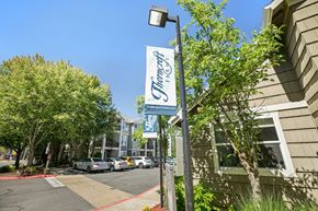 Hillsboro apartment for rent - A street view of a building with a sign that says "Trinity's".