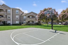 Vacaville apartment for rent - an outdoor basketball court in front of an apartment building