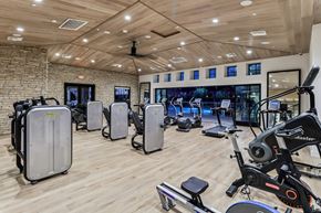 Carlsbad apartment for rent - A gym with a variety of exercise equipment including treadmills, stationary bikes, and weight machines.
