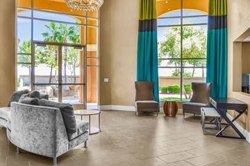 Chandler apartment for rent - a living room with couches and chairs and large windows