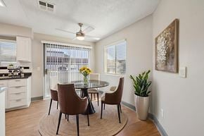Henderson apartment for rent - A dining room with a table and chairs.