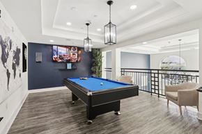Northridge apartment for rent - A pool table in a room with a balcony.