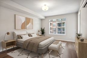 Tacoma apartment for rent - a bedroom with a large bed and a window