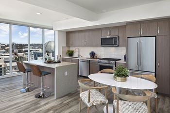 Stainless steel appliances including built-in microwave, refrigerator, and dishwasher