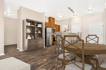 Wood-style plank flooring in kitchen and living areas