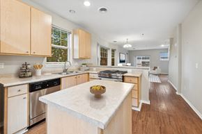 Portland apartment for rent - a large kitchen with an island with a bowl of fruit