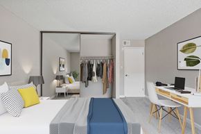 Sparks apartment for rent - a bedroom with a bed and a desk and a closet