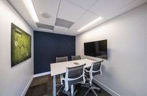 Milpitas apartment for rent - coworking space with a white table and chairs and a television