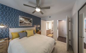 Milpitas apartment for rent - a bedroom with a large bed and a ceiling fan