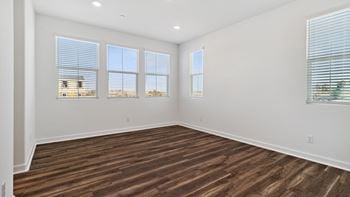 Wood-style plank flooring in kitchen and living areas