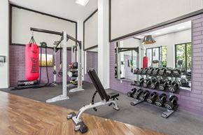 San Jose apartment for rent - fitness center with weights and a red punching bag