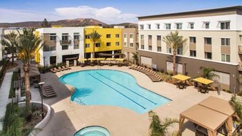 2 Resort-style pools with expansive sundeck, private cabanas, and spa