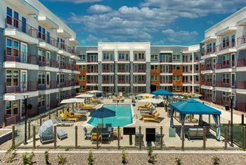 Relaxing resort-style pool with sundeck cabanas and spa